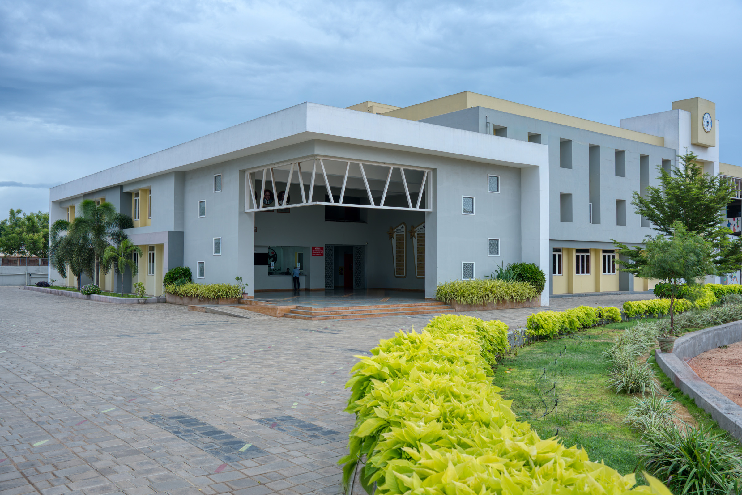 Elgi School exterior facade with landscaped pathway — Coimbatore