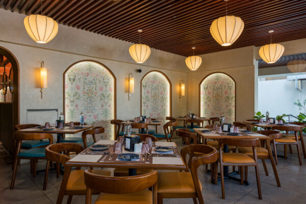 Full dining floor overview with warm pendant lighting — 4 Cups Restaurant, Coimbatore