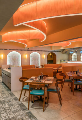 Main hall overview with mixed seating and warm tones — 4 Cups Restaurant, Coimbatore