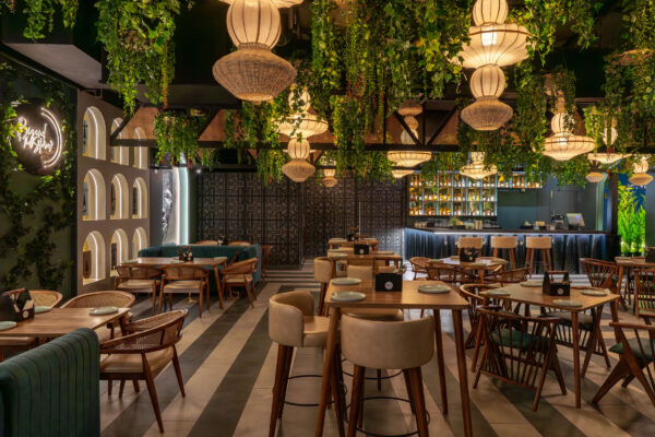 Ambient ceiling lights and greenery interior photography at BTS Pub Coimbatore