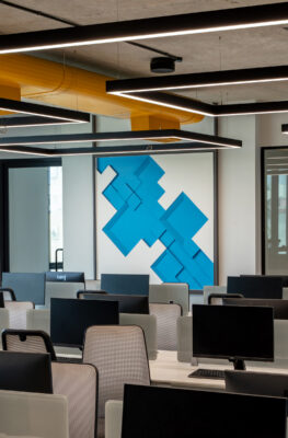 Open floor workstation area with yellow accents — Cuboid, Coimbatore