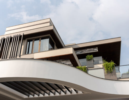Contemporary exterior facade with cantilevered canopy — Dr. Subramaniam House, Namakkal