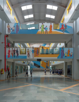 Multi-level atrium interior with vibrant colour scheme — Elgi School, Coimbatore