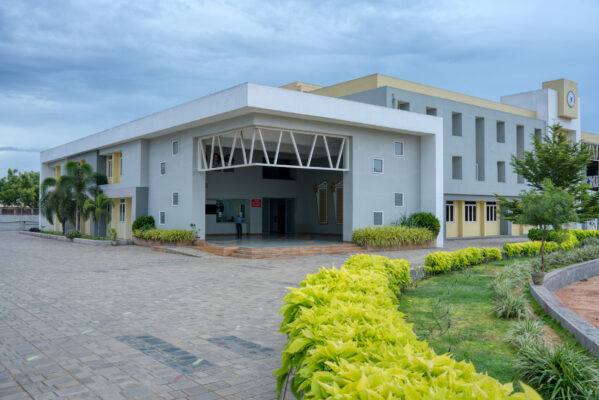 Elgi School exterior facade with landscaped pathway — Coimbatore