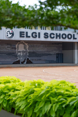 School entrance with Elgi School signage and greenery — Coimbatore