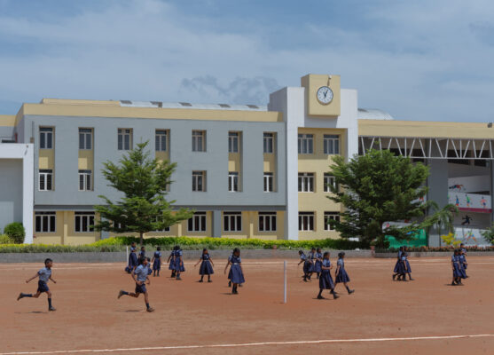 Elgi School exterior building with students — Coimbatore