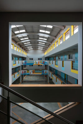 Interior corridor with modern railing and overhead lighting — Elgi School, Coimbatore