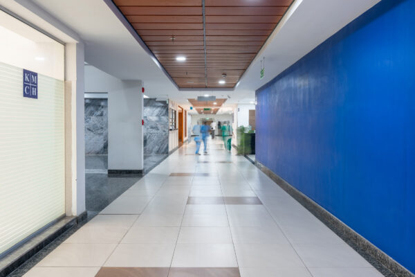 Wide hospital corridor with modern lighting — KMCH, Coimbatore