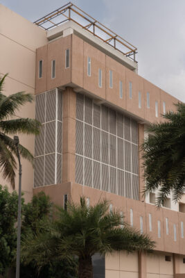Hospital building exterior with approach road — KMCH, Coimbatore