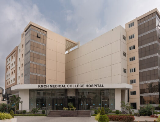 Corner view of hospital exterior architecture — KMCH, Coimbatore
