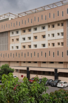 Hospital exterior facade with landscaping — KMCH, Coimbatore