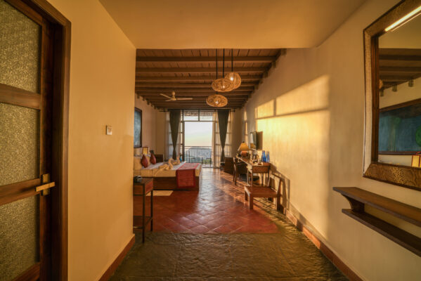 Hotel corridor with warm toned flooring and lighting — Mangohills Hotel, Yercaud