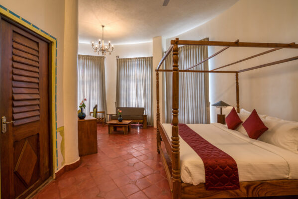 Guest room interior with warm furnishings — Mangohills Hotel, Yercaud
