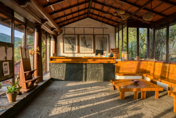 Restaurant interior with rustic ceiling and seating — Mangohills Hotel, Yercaud