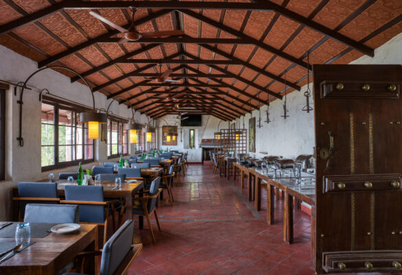 Heritage verandah with colonnade and warm lighting — Mangohills Hotel, Yercaud